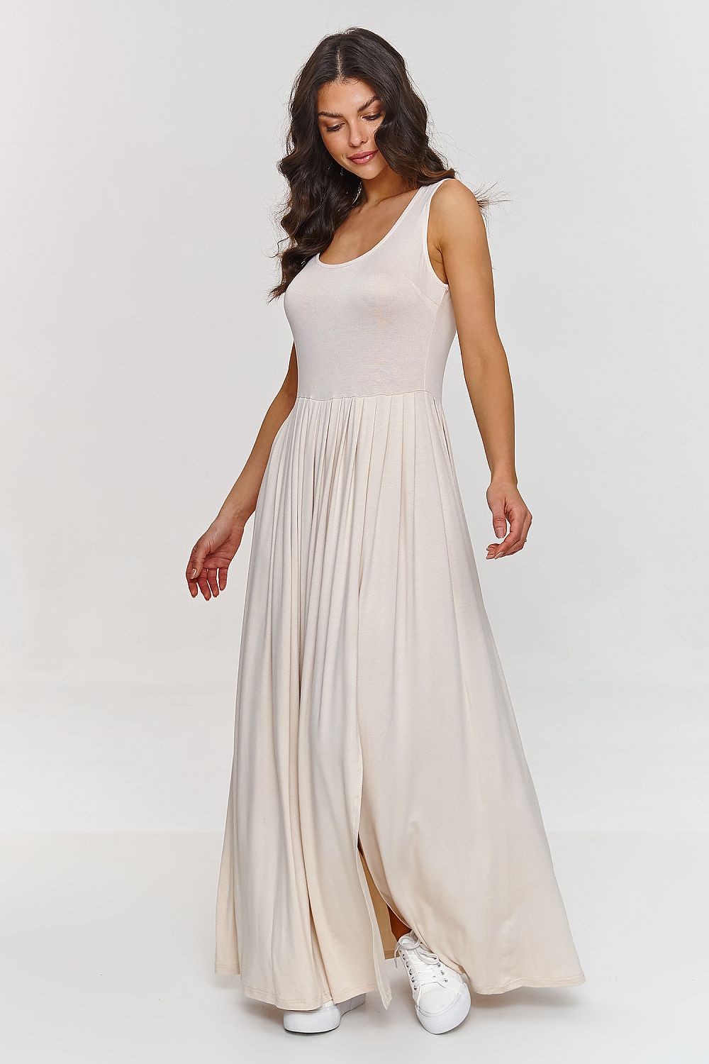 Model wearing Makadamia's stunning maxi dress, paired with chic accessories, showcasing versatile styling options for upscale events.