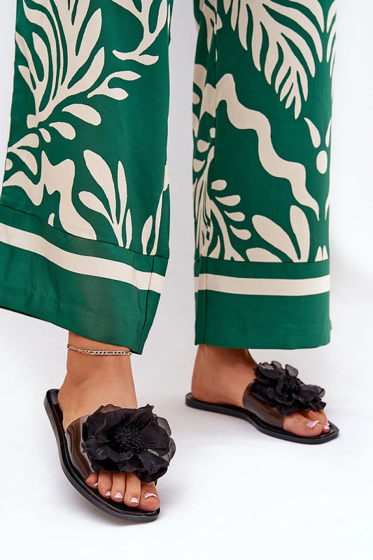 Luxury women's transparent sandals adorned with a delicate flower detail, designed by Step in Style, perfect for summer elegance.