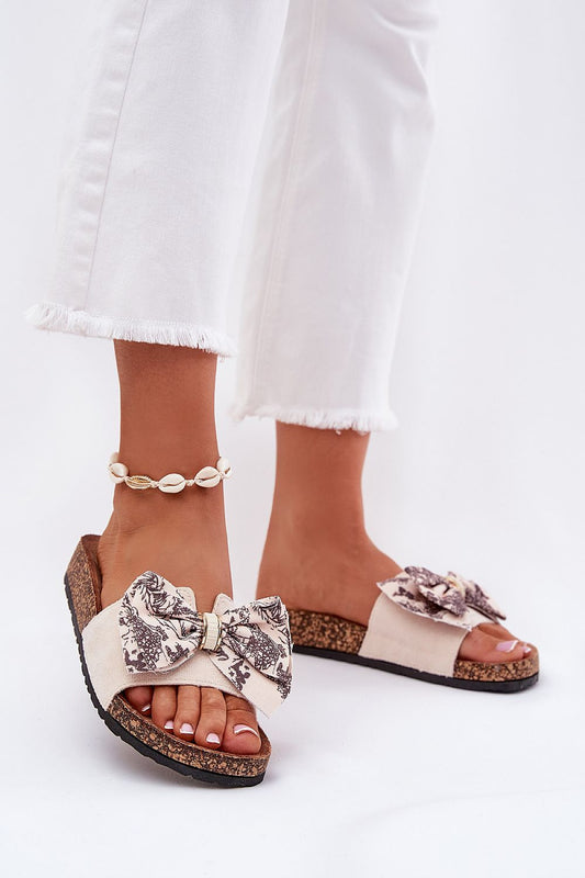 Luxury cork sole slippers adorned with a stylish bow, crafted from eco suede, featuring a contoured insole, perfect for summer days by Step in Style.