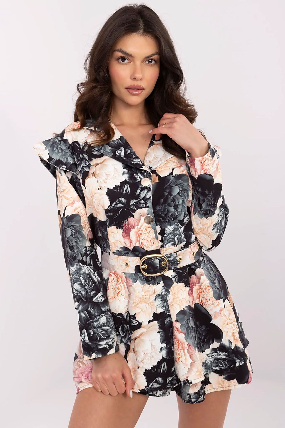 Elegant women's mini jumpsuit by Italy Moda featuring a floral print, ruffled shoulders, and long sleeves, perfect for classy outings and formal occasions.