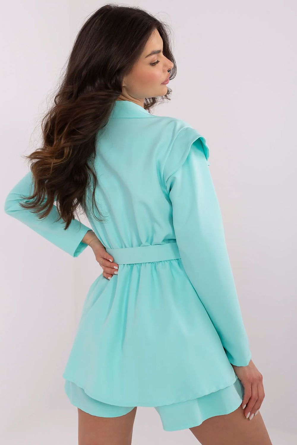 Elegant women's mini jumpsuit by Italy Moda featuring a trendy floral print and ruffled shoulders, ideal for formal events.