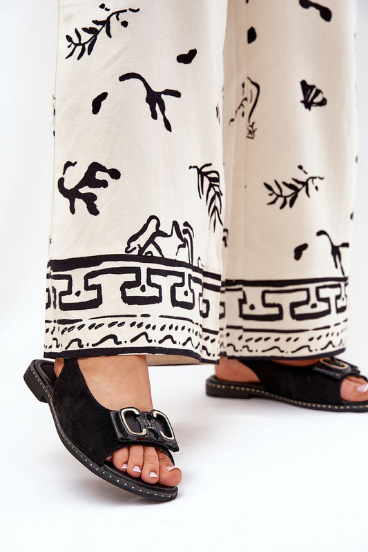 Luxurious Jezzi Women's Flat Faux Suede Sandals with Elegant Adjustable Buckle Strap, showcasing high-quality design and comfortable fit, perfect for stylish outings.