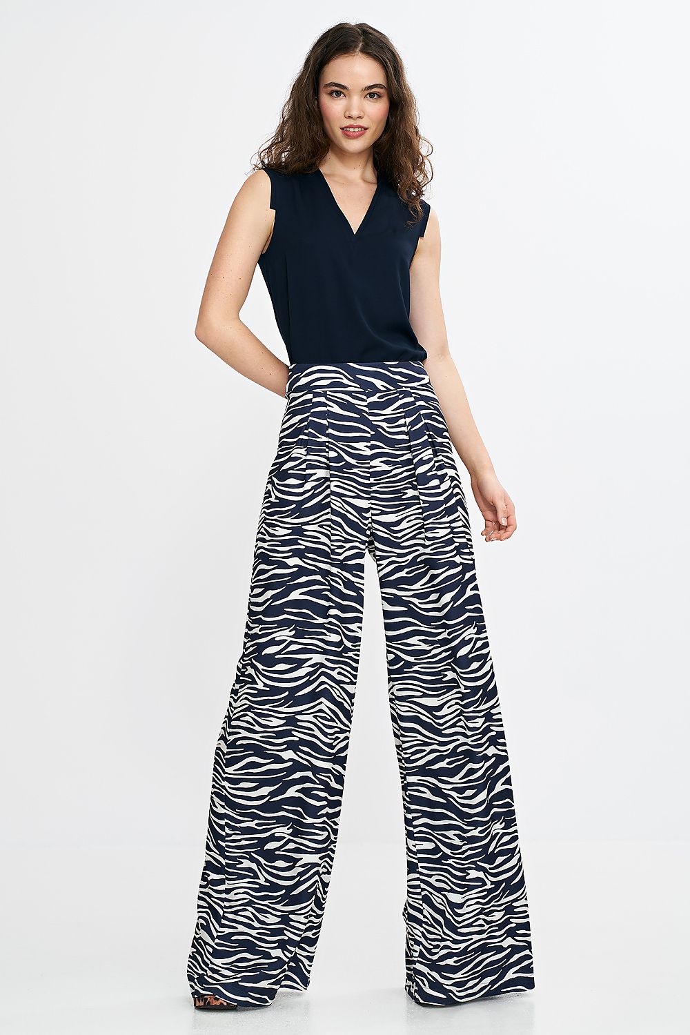 Nife Women's Palazzo Trousers with a striking silhouette and comfortable fit, tailored from a premium polyester and spandex blend, ideal for formal occasions.