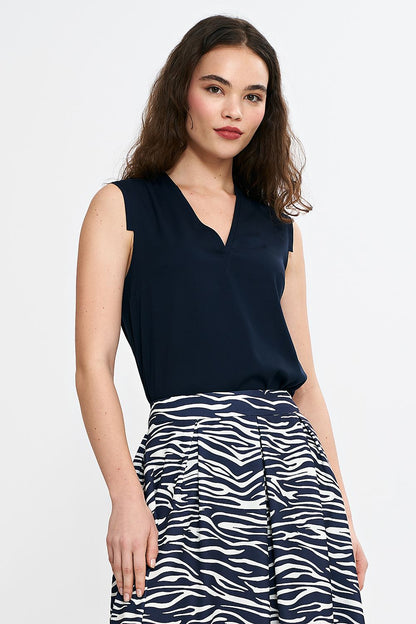 Close-up of Nife's V-neck sleeveless blouse, highlighting the premium viscose fabric and chic design details.