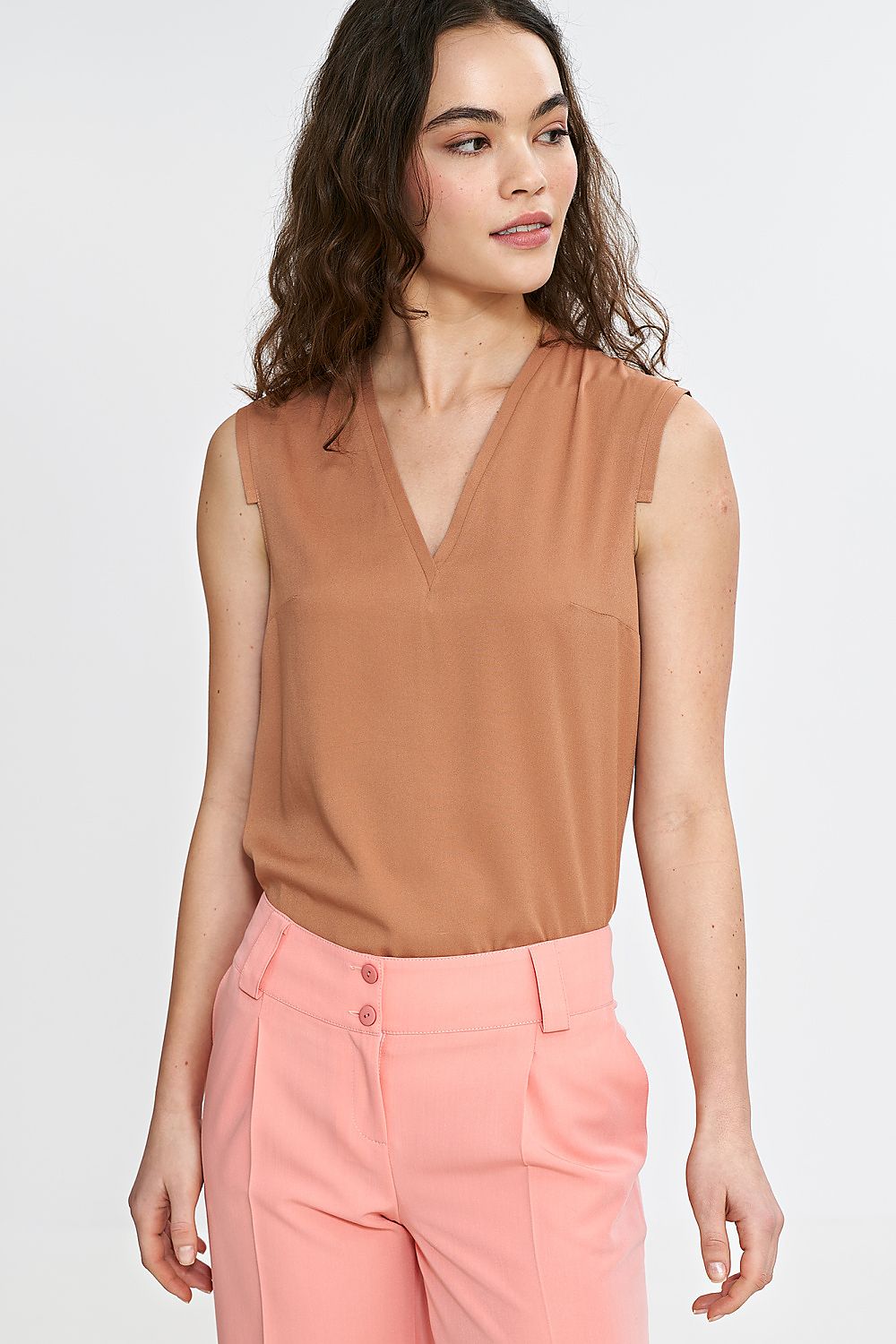 Nife women's blouse displayed elegantly on a mannequin, focusing on the luxurious fit and soft fabric texture.