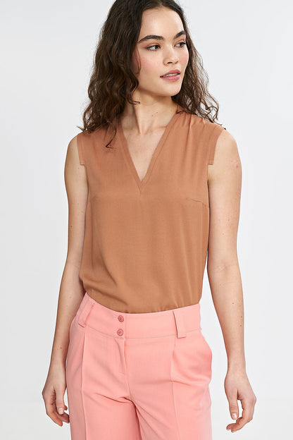 Nife women's blouse displayed elegantly on a mannequin, focusing on the luxurious fit and soft fabric texture.