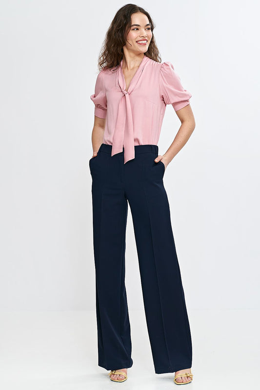 Stylish Nife blouse made of breathable viscose, showcasing an elegant design with a decorative tie at the V-neckline.