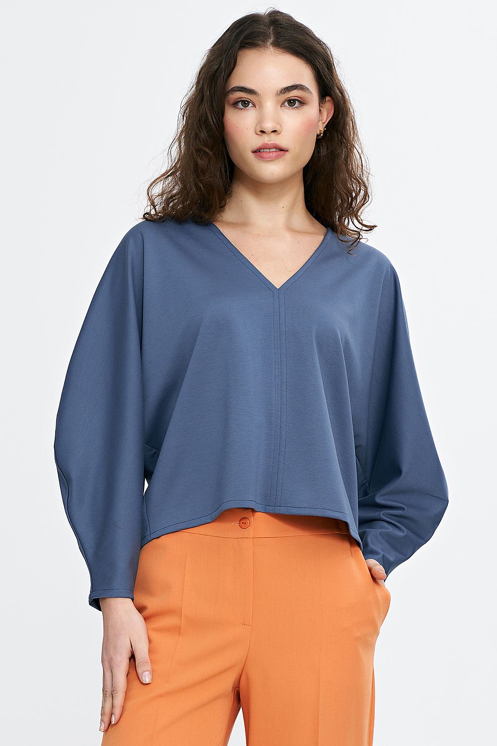 Detail of Nife oversized V-neck blouse demonstrating the plush texture and refined styling of the viscose blend material, designed for ultimate comfort and style.