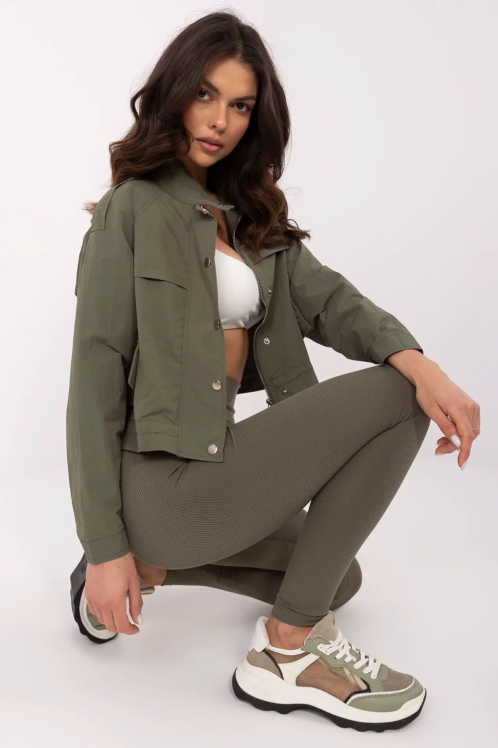 NM luxury women's windbreaker jacket displayed on a hanger, showcasing its elegant structure and stylish features, ideal for everyday wear.