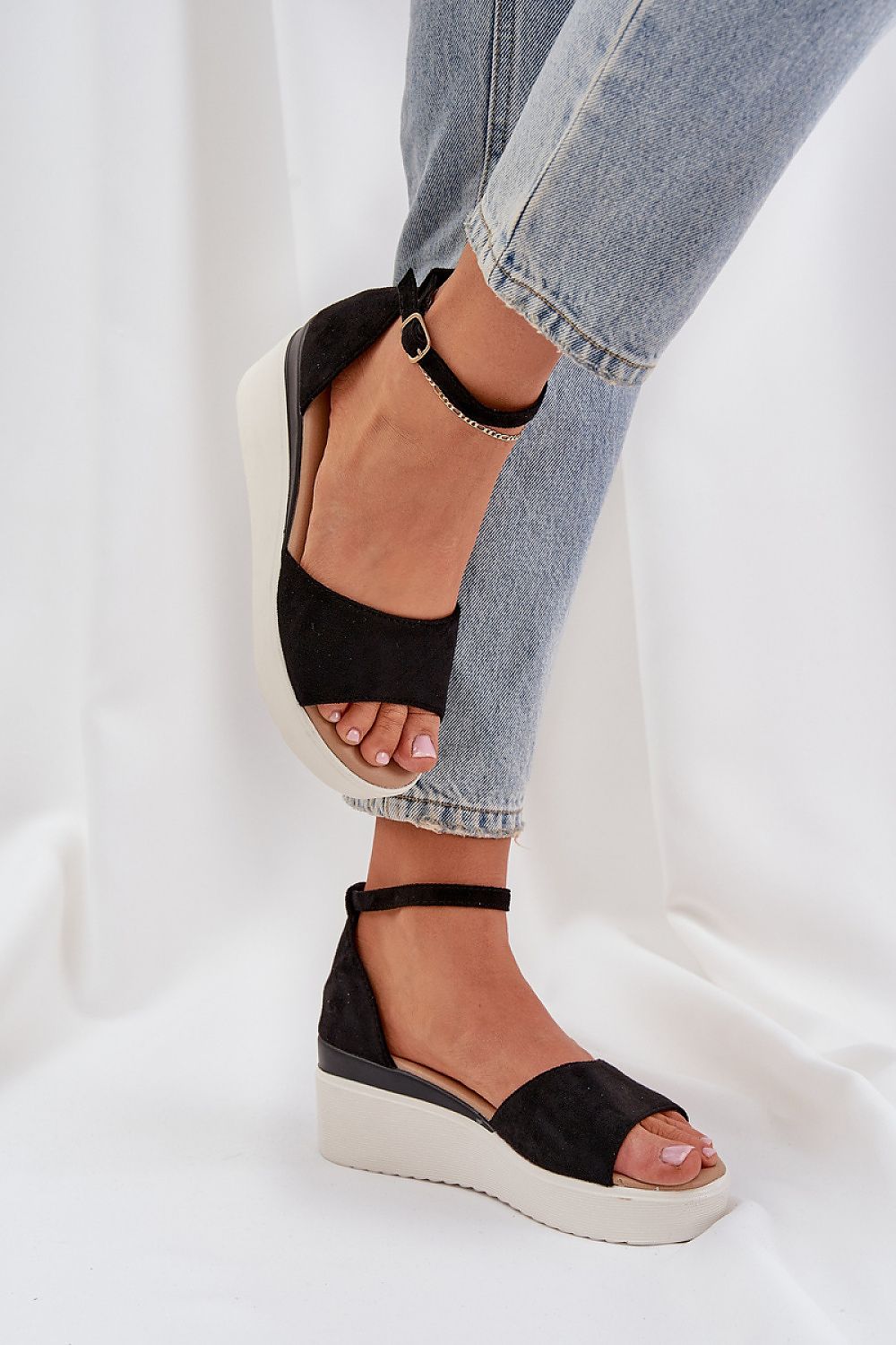 Trendy Step in Style Eco Suede Sandals with a delicate wedge heel and adjustable strap, ideal for sophisticated warm weather fashion.