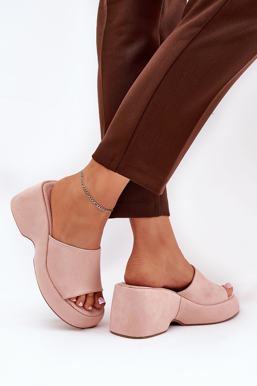 Step in Style's luxury women's platform wedge sandals in imitation suede, depicted in a flattering angle to emphasize their graceful silhouette and modern appeal.