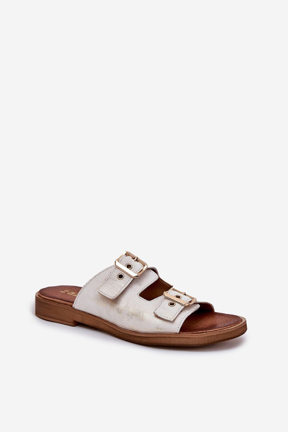 Close-up view of luxury women's leather slides with adjustable golden buckles from Step in style, showcasing their exceptional craftsmanship.
