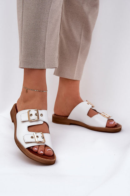 Luxury women's leather slides with flat heel and adjustable gold buckles by Step in style, designed for comfort and sophistication.