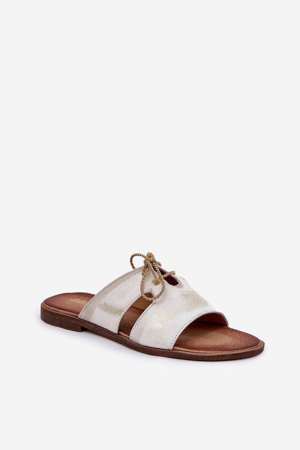 Close-up of luxurious natural leather sandals with golden cord detailing, designed by Step in Style for sophisticated summer fashion.