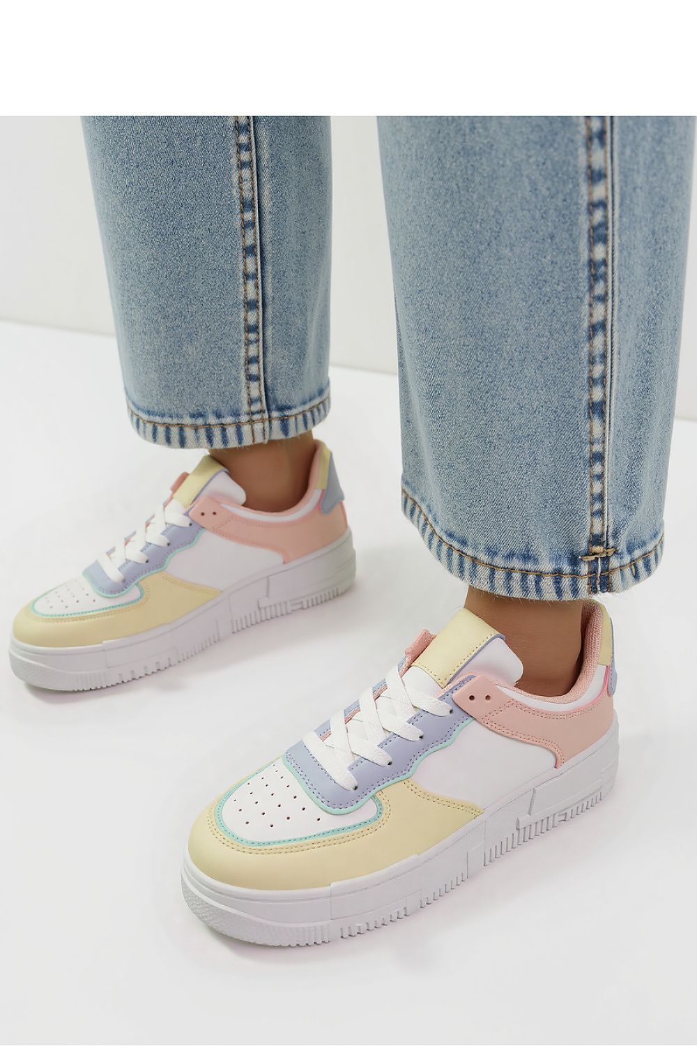 Oasis Multe Women's Pastel Sneakers by Inello showcased from a side view, displaying the unique blend of pink, blue, and yellow accents for an eye-catching casual style.