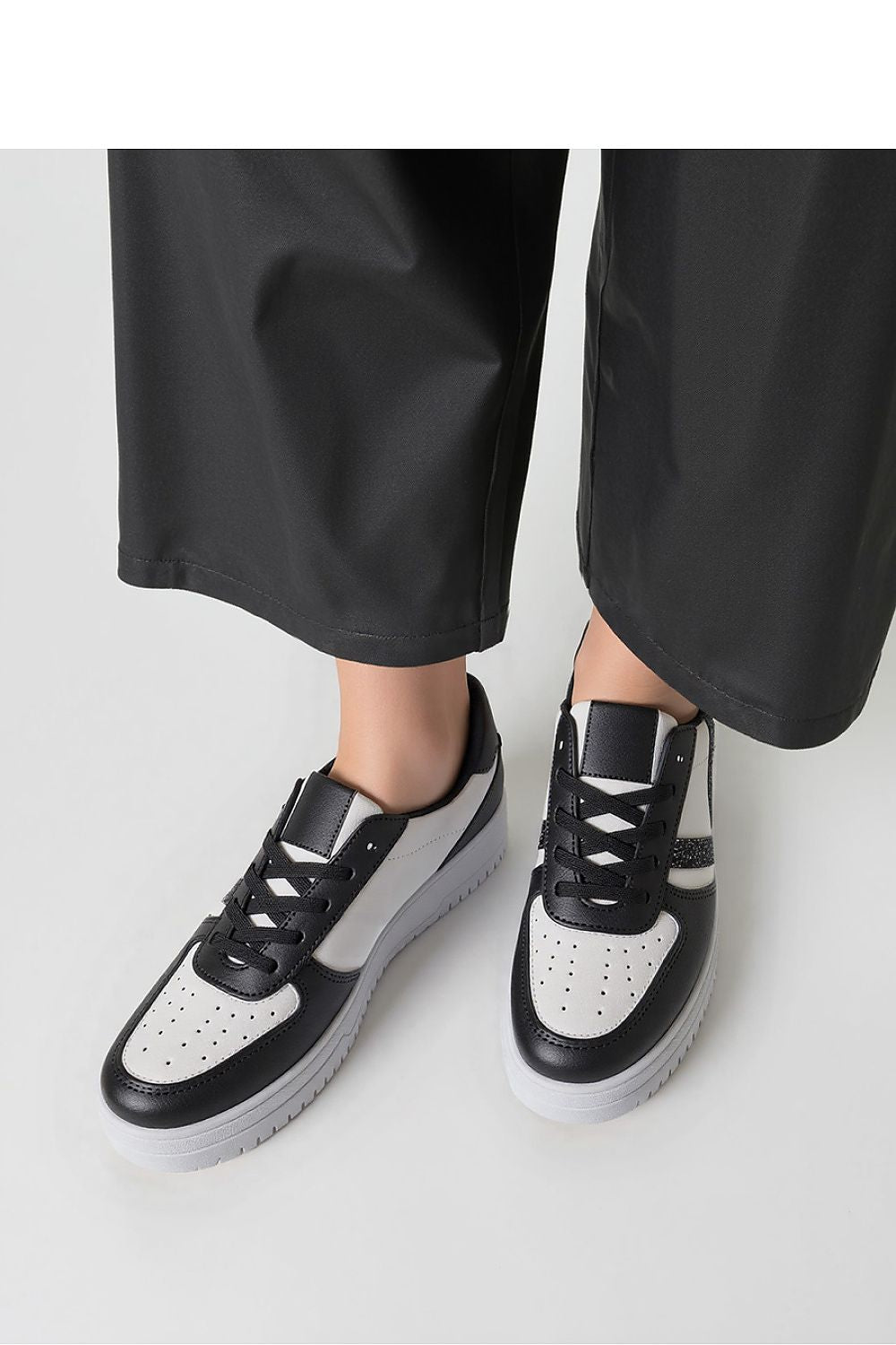 Elegant Inello LORENEX Black Sneakers featuring a smart colour contrast of black and white, ideal for both casual and stylish outfits.