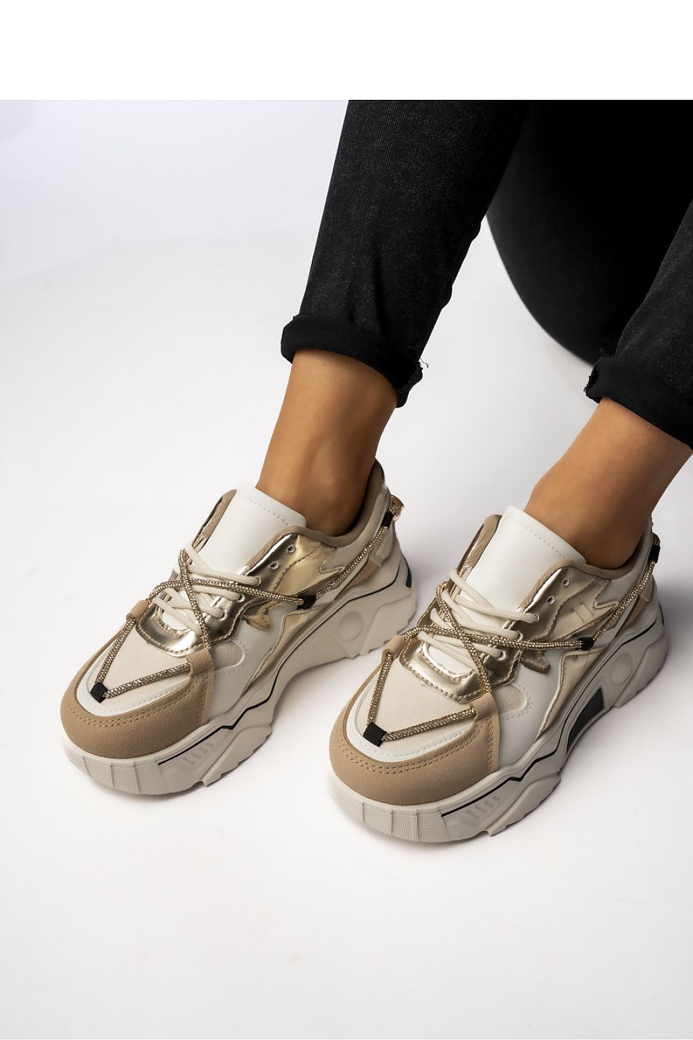 Chic Veyra Beige Women's Sneakers by Inello showcasing decorative gold laces and a stylish chunky sole, perfect for adding elegance to any outfit.