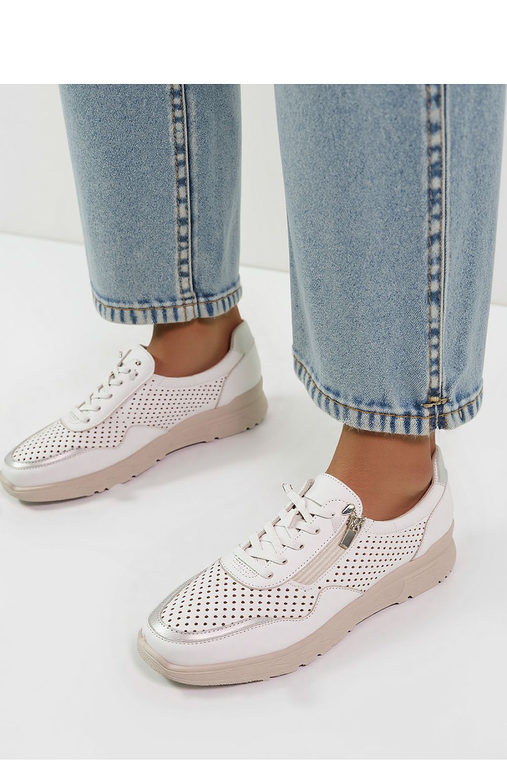 Elegant Inello AVERIA white sneakers featuring gold accents and perforated eco leather, perfect for stylish everyday wear.