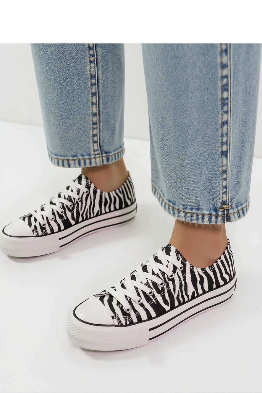 Inello Savana Zebra Sneakers showcasing a unique animal print design - lightweight textile perfect for a luxurious streetwear style.