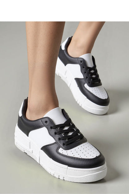 Luxurious Inello Vexana black eco-leather sneakers for women with a stylish design and thick rubber sole, perfect for comfort and versatility in fashionable outfits.