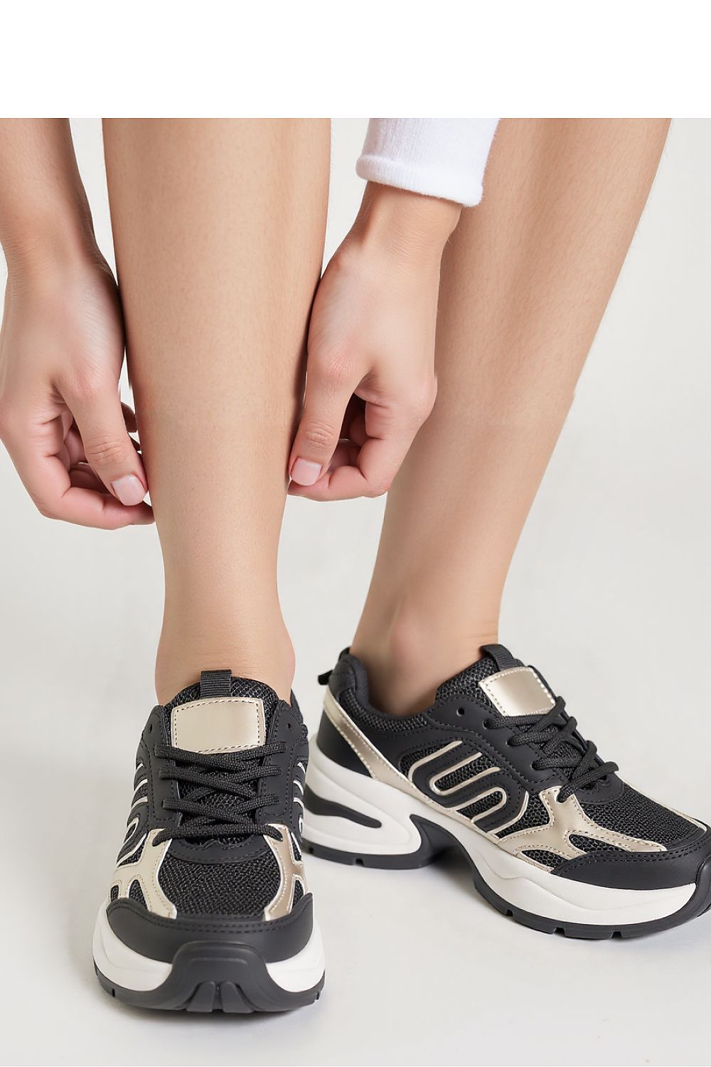 Close-up of Ynova Black Women's Sneakers by Inello showcasing the premium synthetic leather upper and metallic accents.