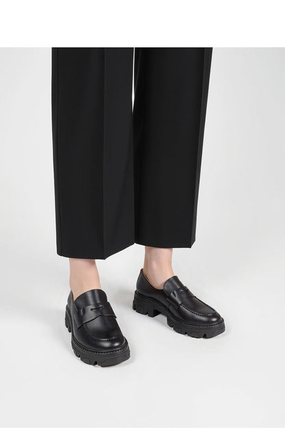 Close-up view of Inello Monza Nero sophisticated loafers highlighting the premium synthetic leather material and intricate stitching.