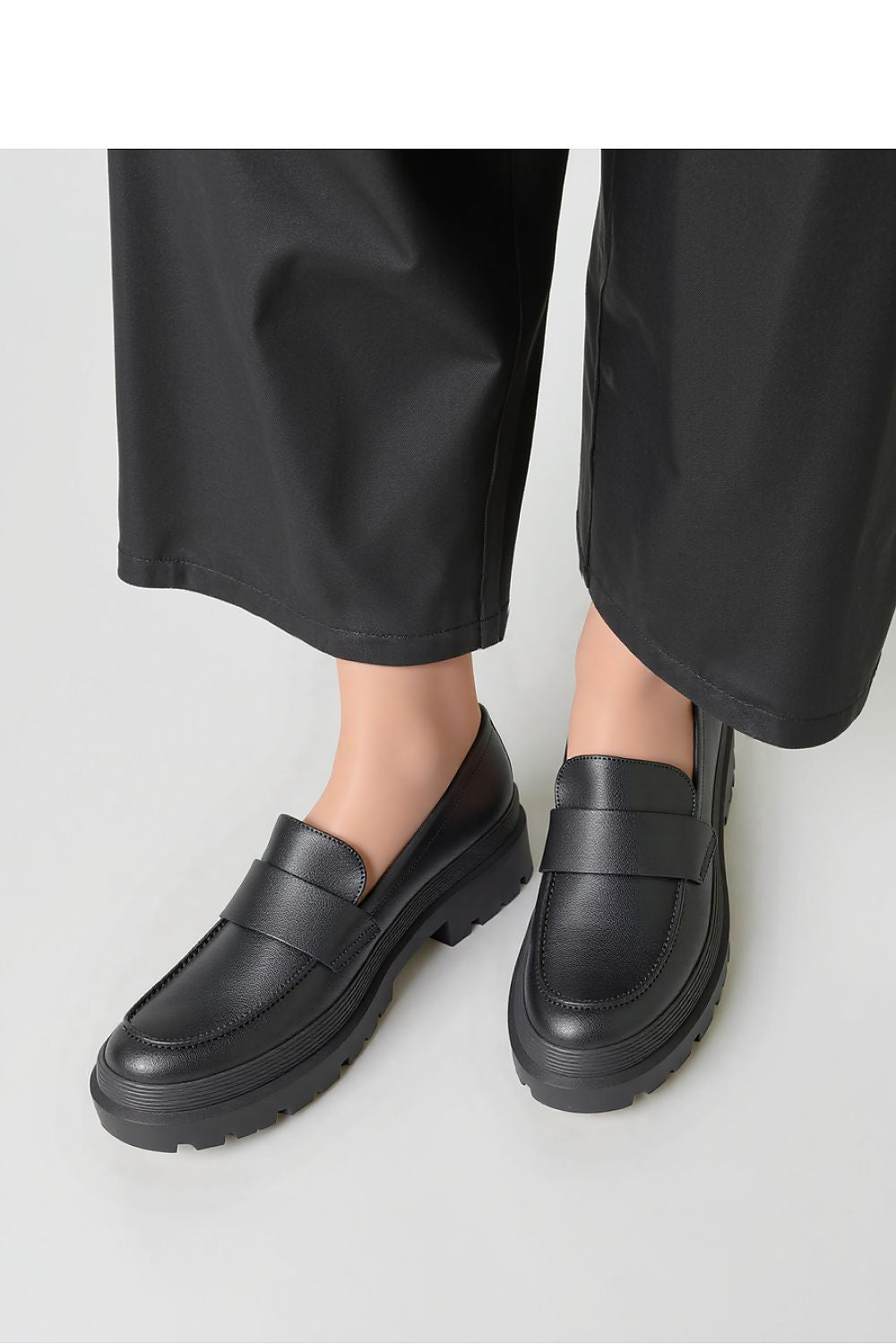 Close-up of Inello CARRERA Nero classy slip-on moccasins showcasing premium synthetic leather and contemporary design.