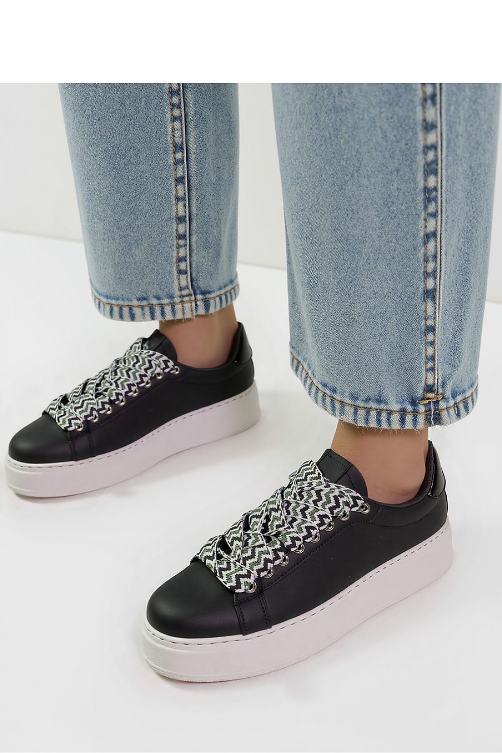 Elegant view of Zarax Black Platform Sneakers by Inello, showcasing their sleek synthetic leather construction and striking white sole perfect for luxury casual wear.