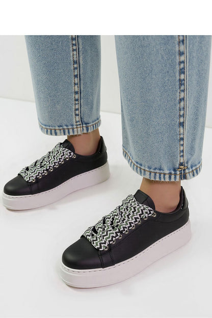 Elegant view of Zarax Black Platform Sneakers by Inello, showcasing their sleek synthetic leather construction and striking white sole perfect for luxury casual wear.