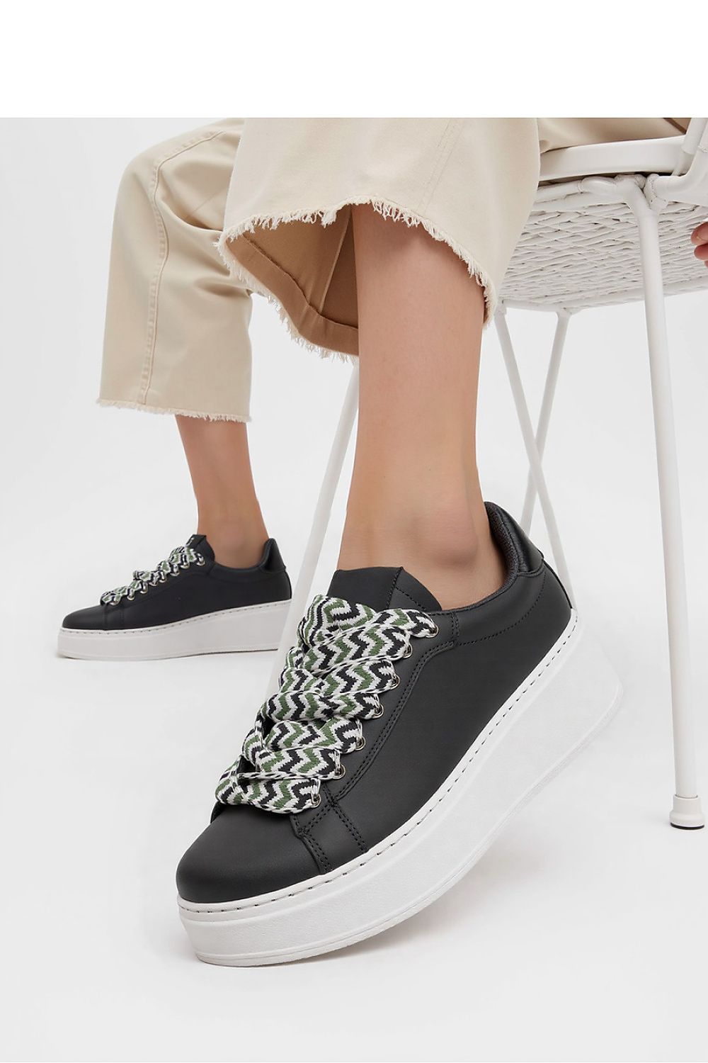 Zarax Black platform sneakers for men and women by Inello, featuring stylish synthetic leather and designer patterned laces against a modern white sole.