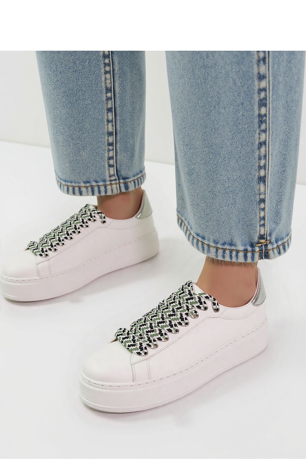 Close-up view of ZARAX White Minimalist Platform Sneakers showcasing their synthetic leather upper and unique patterned laces by Inello.