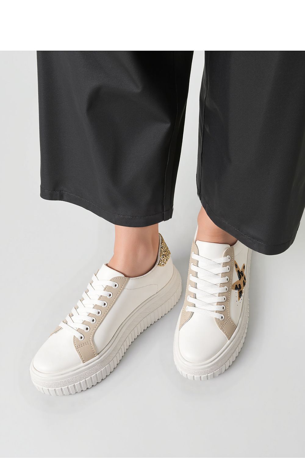 Close-up view of NOVAX Beige Leopard Star Platform Sneakers, showcasing high-quality textile and synthetic leather materials for a sophisticated look.