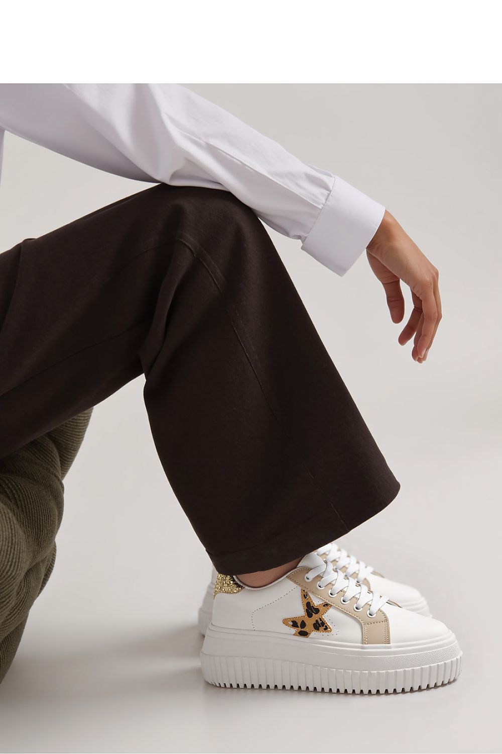 NOVAX Beige Leopard Star Platform Sneakers displayed from the side, highlighting their modern platform sole and chic beige and white colour scheme.