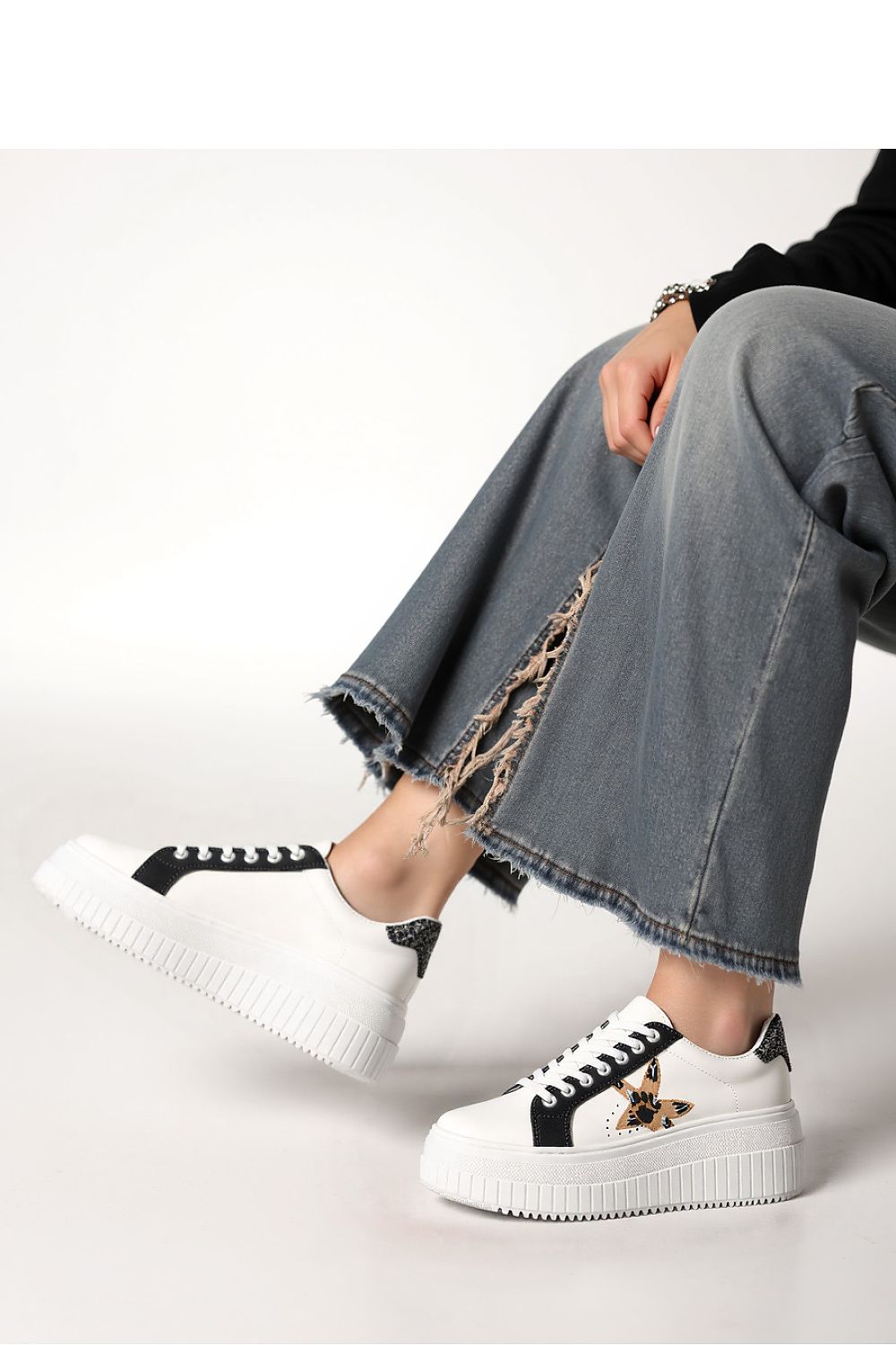 Stylish NOVAX Black Panther Motif Platform Sneakers emphasizing the thick sole and unique design, ideal for fashionable comfort for women.