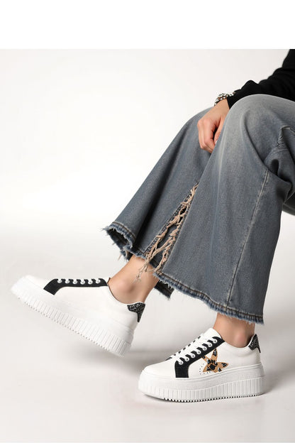 Stylish NOVAX Black Panther Motif Platform Sneakers emphasizing the thick sole and unique design, ideal for fashionable comfort for women.