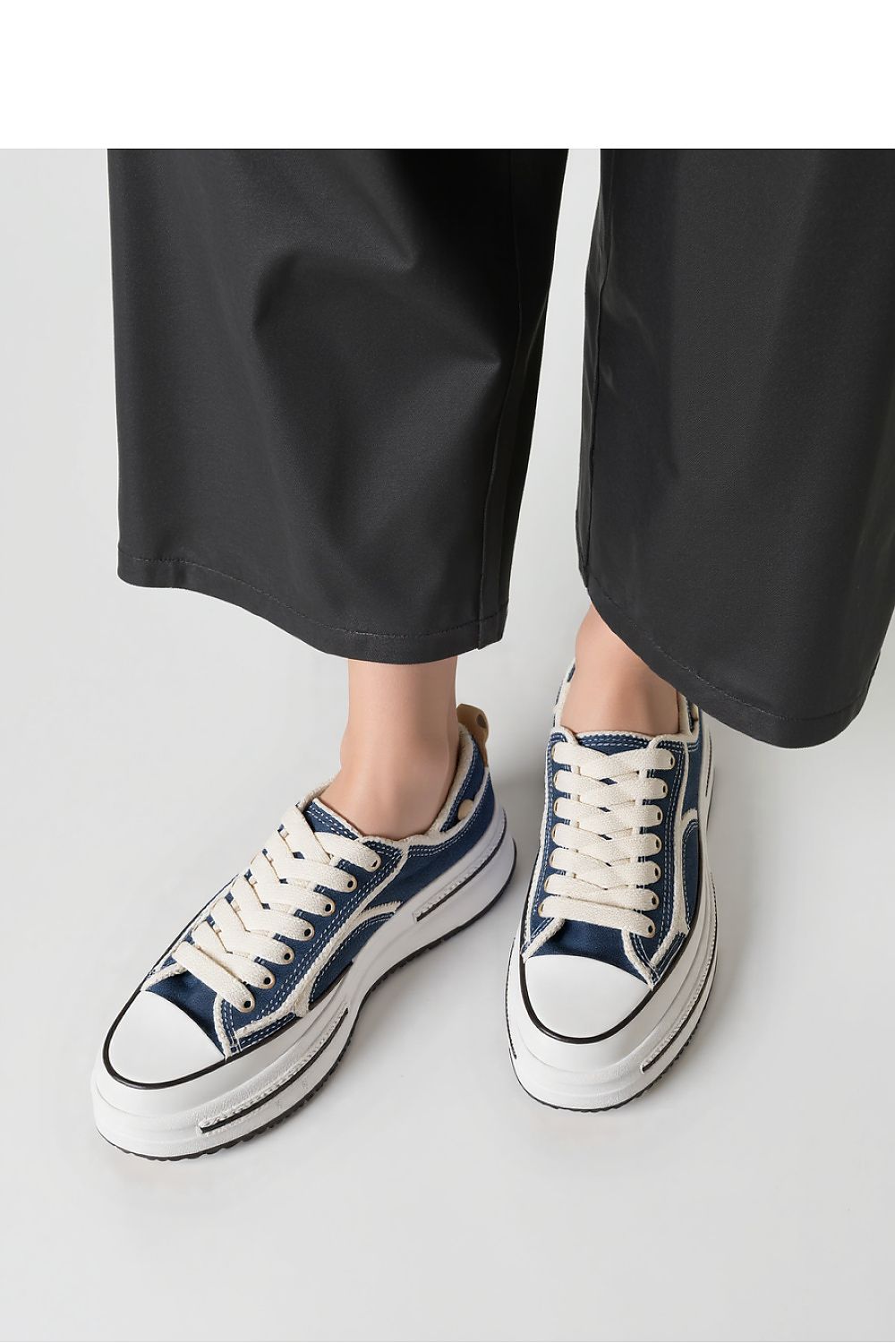 Close-up of Inello ROGUE Vintage Denim Sneakers, featuring frayed denim accents and a robust chunky sole for urban elegance.