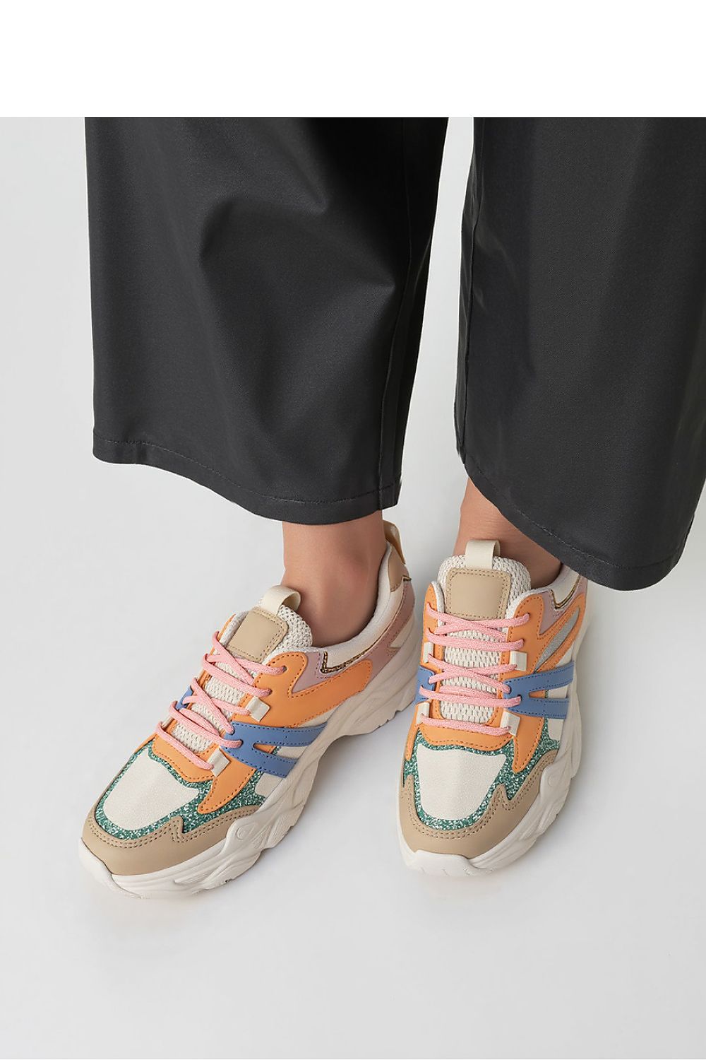 Stylish men's and women's Vega Orange sport sneakers by Inello, showcasing a vibrant blend of orange, beige, blue, and green with glossy accents.