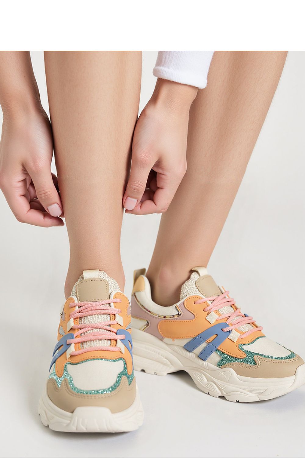 Close-up of Vega Orange sport sneakers, featuring eco-leather and textile materials by Inello, perfect for a fashionable yet sporty look.