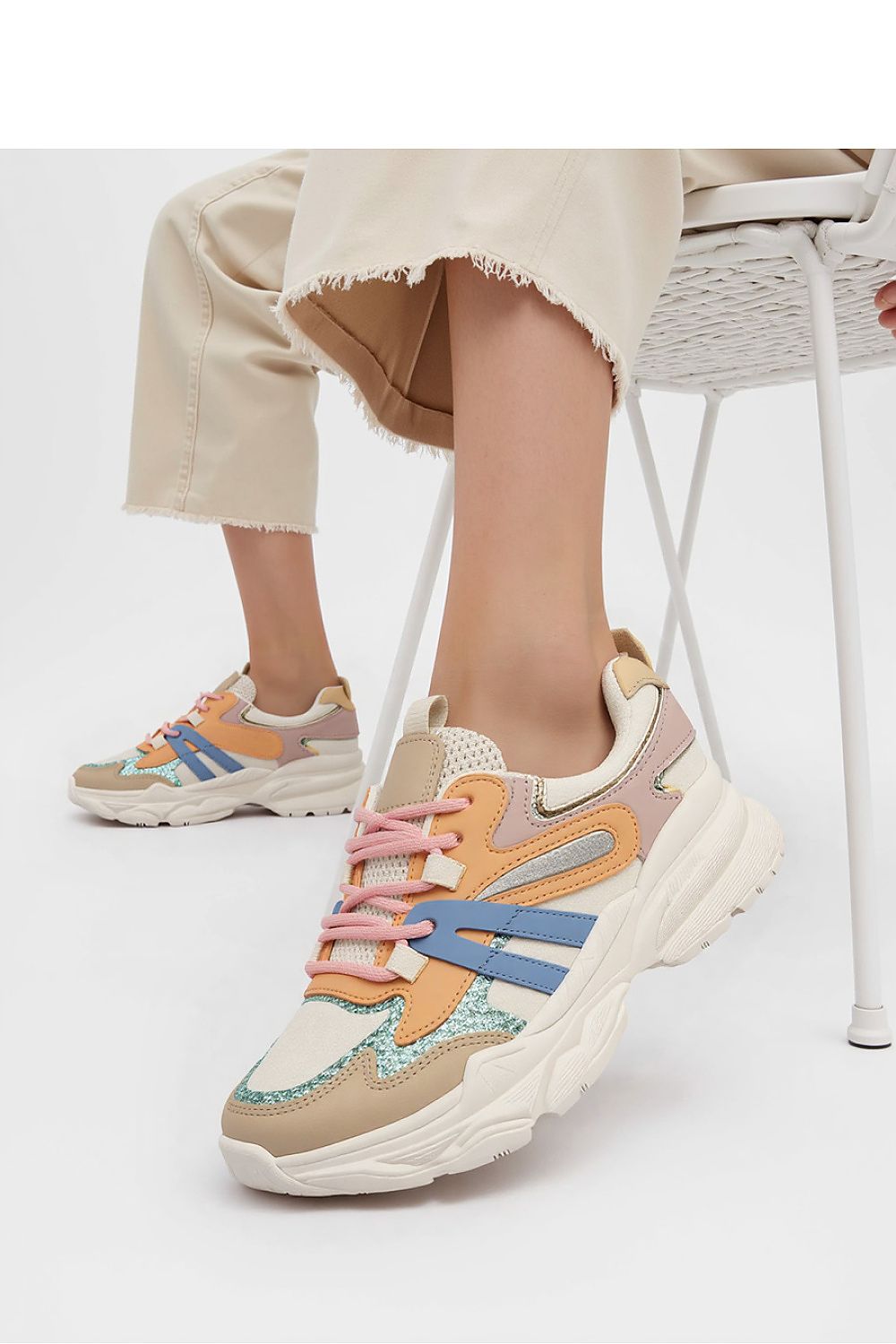 Vega Orange stylish sport sneakers for men and women from Inello, highlighting their unique design and fashionable colour palette.