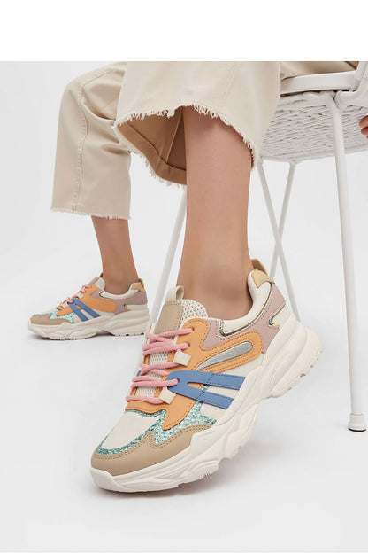 Vega Orange stylish sport sneakers for men and women from Inello, highlighting their unique design and fashionable colour palette.