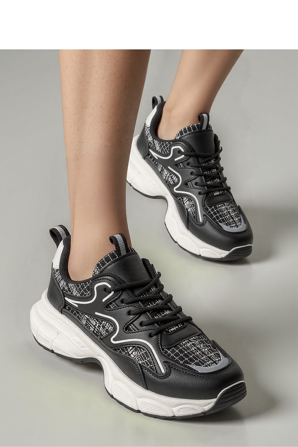 Stellar Black Urban Sport Sneakers for men and women by Inello, featuring a chic eco-leather and textile design, showcasing modern style with white and silver accents.