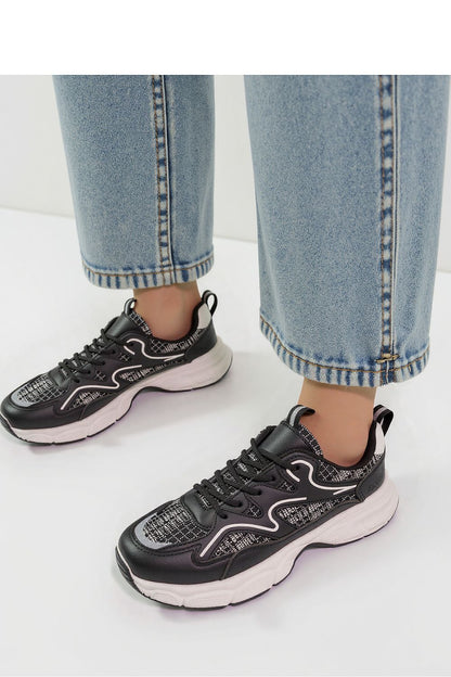 Close-up view of Stellar Black Urban Sport Sneakers by Inello, emphasising the raised sole and eco-friendly materials, perfect for urban sporty chic.