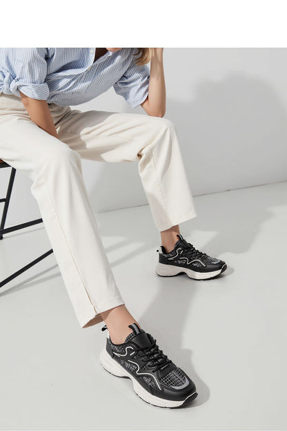 Stylish Stellar Black Urban Sport Sneakers for men and women by Inello, showcasing a chic eco-leather and textile design with a raised sole, perfect for urban and sporty looks.