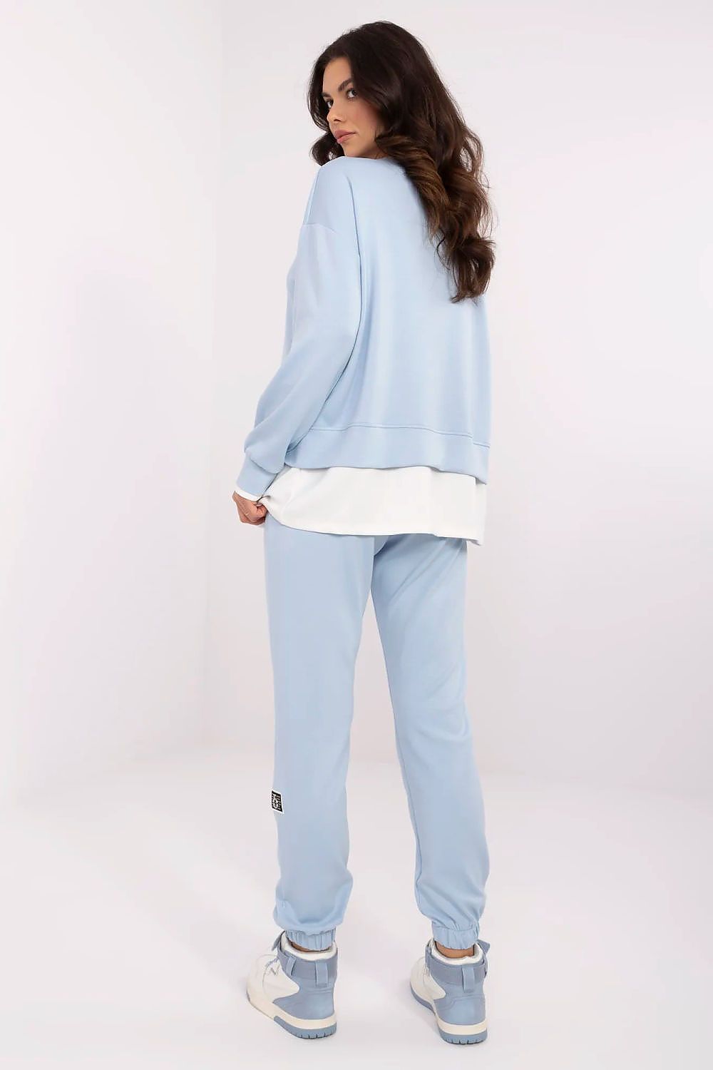 Back view of a luxury women's casual tracksuit set in blue from Relevance, showcasing the comfortable silhouette and modern design ideal for leisure and casual outings.