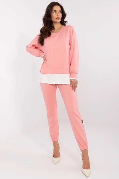 Elegant luxury women's casual tracksuit set by Relevance, showcasing a pink long-sleeve sweatshirt and matching high-waisted pants, ideal for comfortable everyday wear.