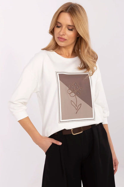 Stylish white women's blouse with a floral print front, perfectly suited for casual elegance, available at Relevance.