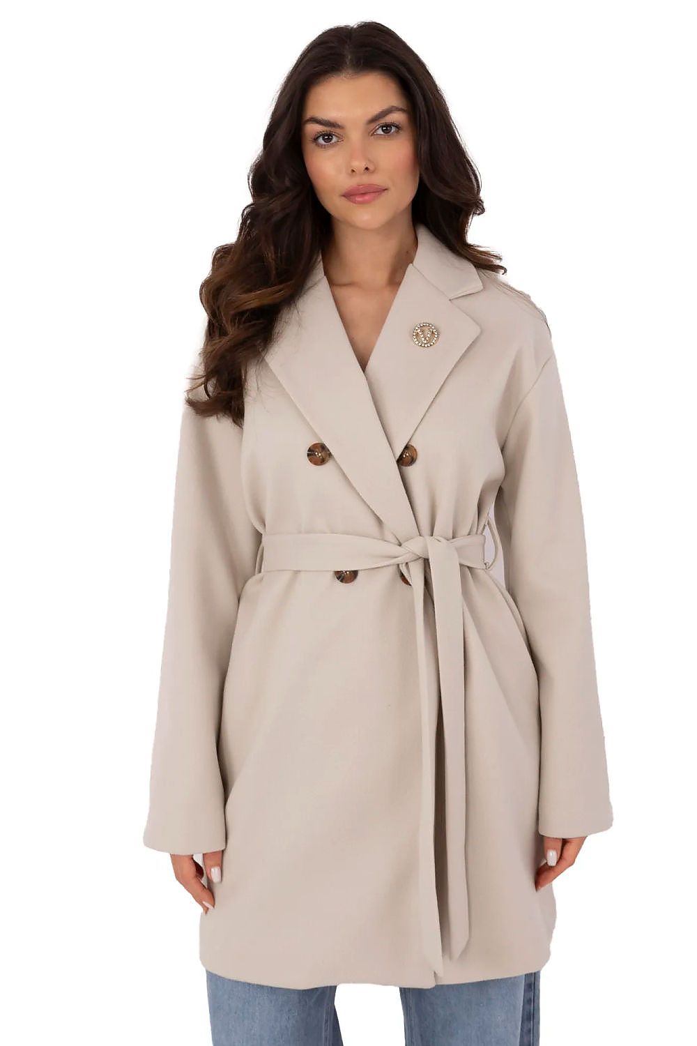 Elegant Och Bella women's transitional coat showcased on a model, featuring a detachable brooch, double-breasted button closure, and a stylish waist belt, perfect for chic autumn and winter outings.