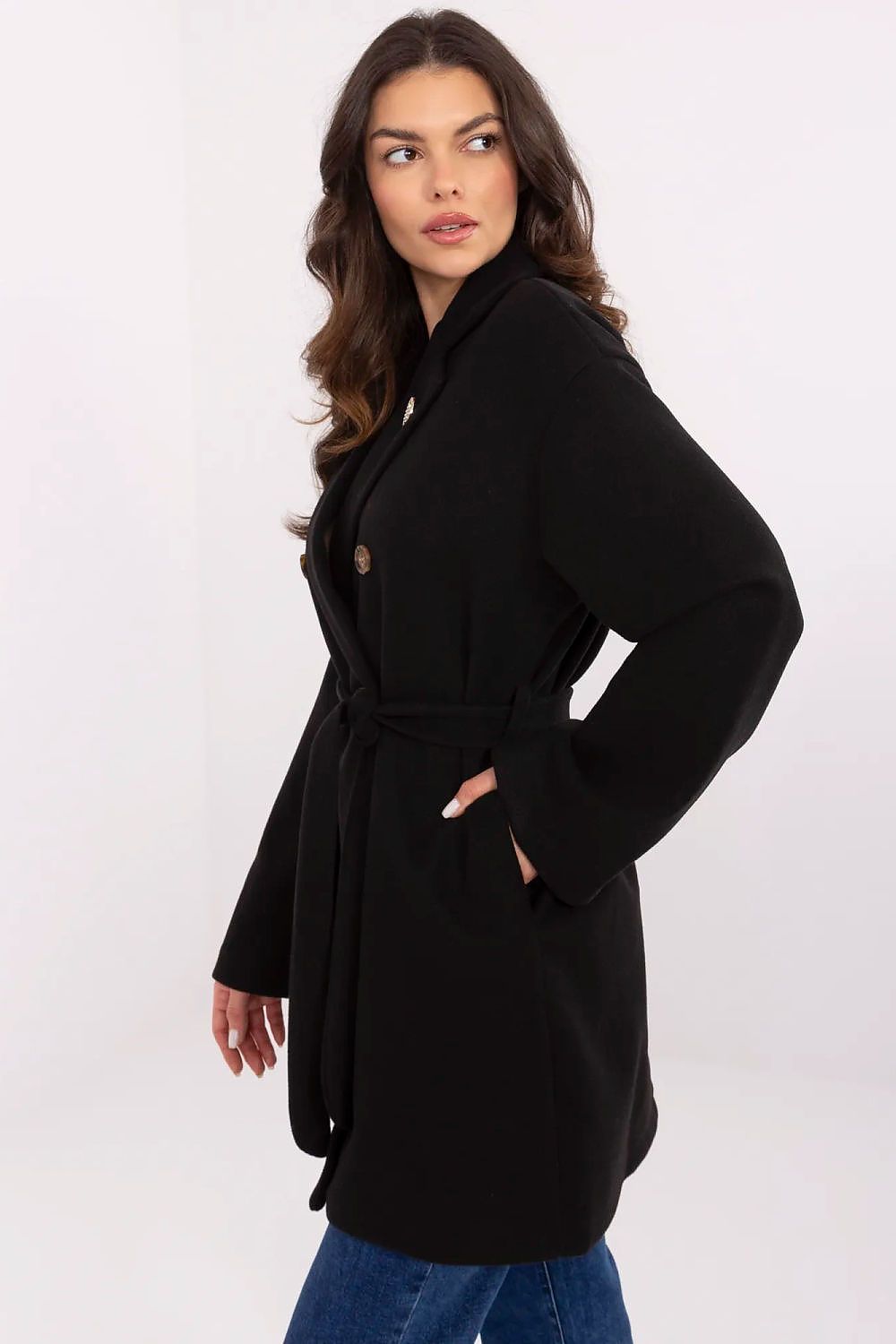 Side view of Och Bella women's black coat with a belted waist and button detailing, embodying elegance and functionality for transitional seasons.