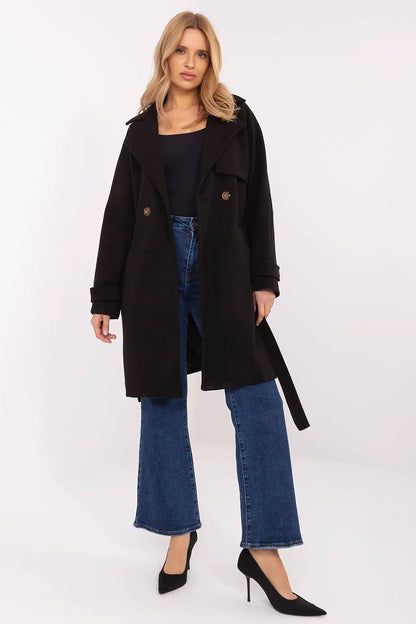 Elegant women's knee-length black double-breasted coat by Och Bella, featuring a stylish design paired with casual denim and heels, perfect for sophisticated everyday wear.