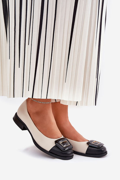 Stylish women's natural leather ballet flats with unique decoration, showcased elegantly with a pleated skirt, by Step in Style.